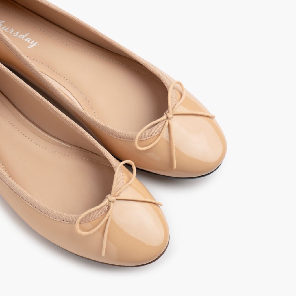 https://cdn.shopify.com/s/files/1/0419/1525/files/1024x1024-Wmn-TinyDancer-BuffPatent-020226-ToeDetail_a9c66380-b395-4f9c-a23e-e208c6acbc1c.jpg?v=1773097458