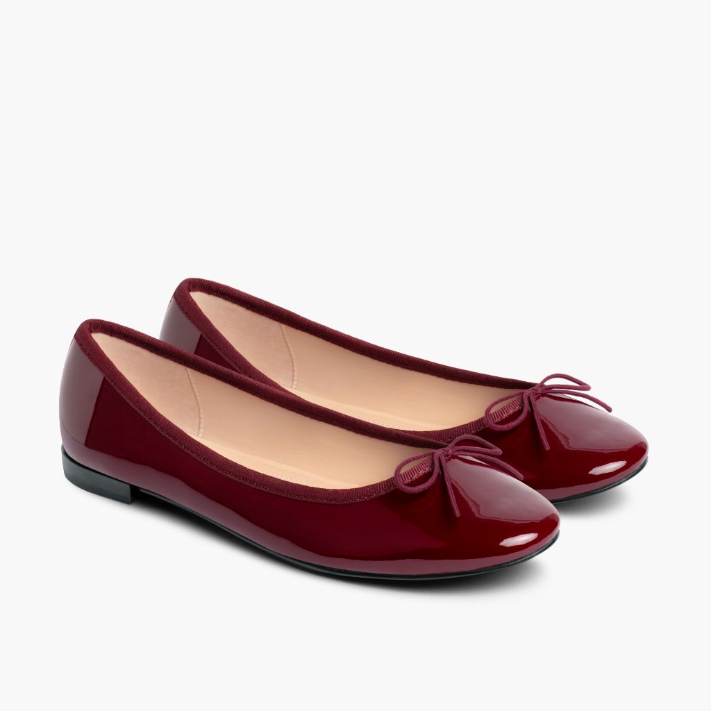 https://cdn.shopify.com/s/files/1/0419/1525/files/1024x1024-Wmn-TinyDancer-BurgundyPatent-020226-3.4_18234043-61ed-43ed-91e3-0cc6233bc970.jpg?v=1773097337