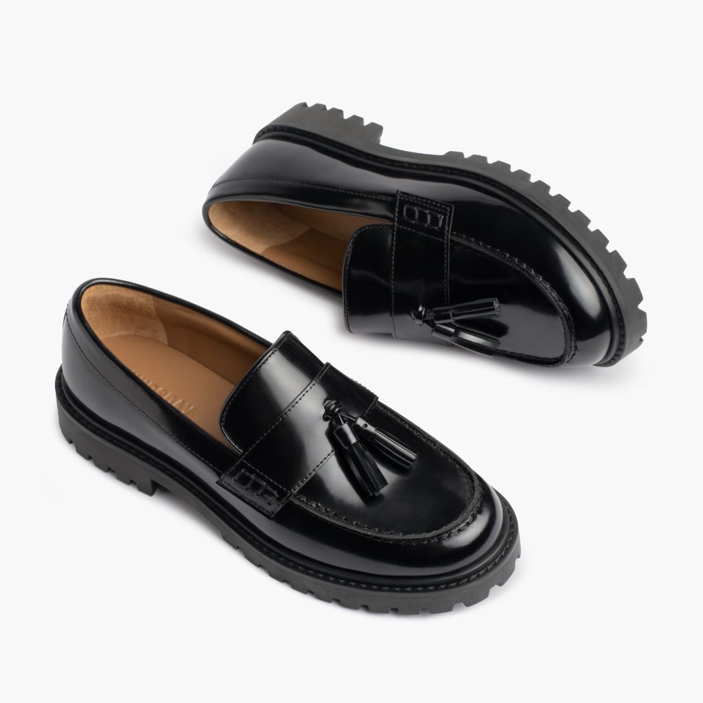 https://cdn.shopify.com/s/files/1/0419/1525/files/1024x1024-Women-TasselPenny-Black-012226-FlatlayAlt.jpg?v=1771868250