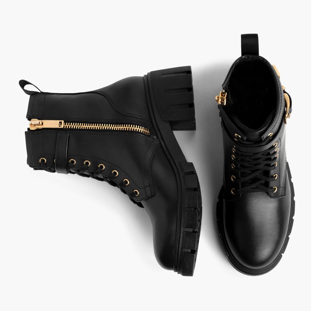 https://cdn.shopify.com/s/files/1/0419/1525/files/1024x1024-Womens-Coda-BlackGold-101424-Flatlay1_2f7257ed-bce4-4464-bfa5-6edb7741b7a2.jpg?v=1729811438