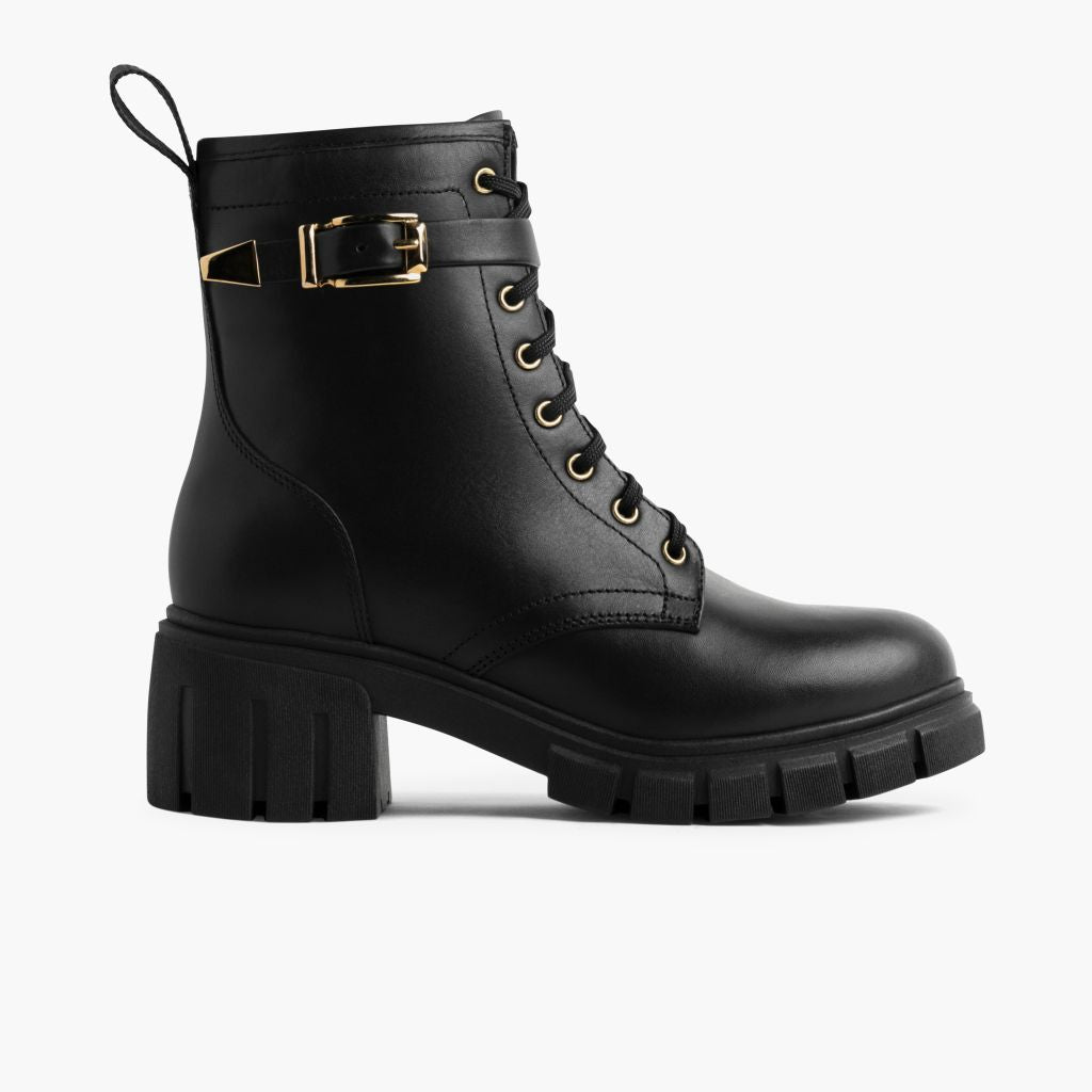 https://cdn.shopify.com/s/files/1/0419/1525/files/1024x1024-Womens-Coda-BlackGold-101424-Side_82c209d4-e560-4541-aa81-6bfaf5e545ed.jpg?v=1729811438