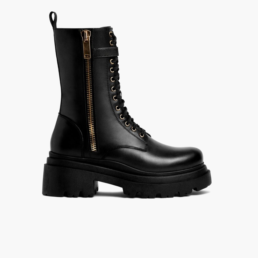 https://cdn.shopify.com/s/files/1/0419/1525/files/1024x1024-Womens-Fatale-BlackGold-100623-SideZip_567f836d-08f4-4d93-8d3d-e9a47d5ecc4a.jpg?v=1696965156